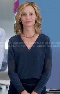 Cat's navy blue v-neck blouse on Supergirl