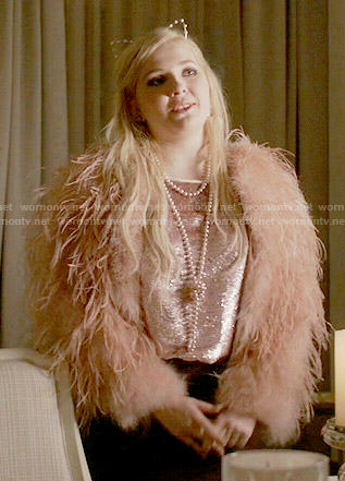 Chanel 5's pink sequin top, feather jacket and pearl ear  headband on Scream Queens