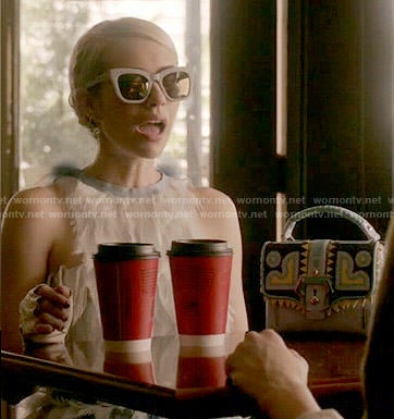 Chanel's feather dress and patterned bag on Scream Queens