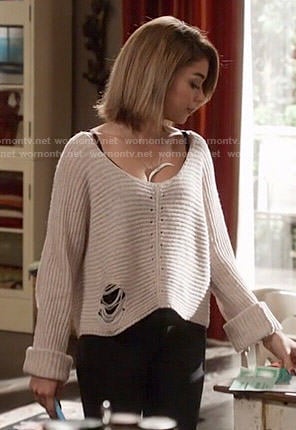 Haley’s grey ripped sweater on Modern Family