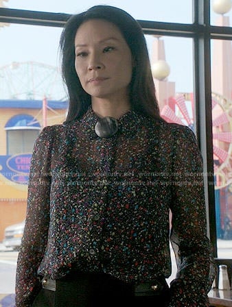 Joan’s confetti print blouse on Elementary