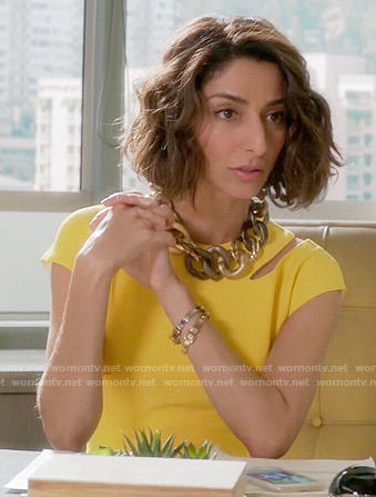Delia’s yellow dress with cutout shoulder on Girlfriends Guide to Divorce