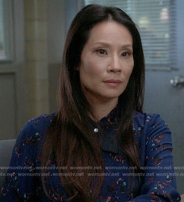 Joan's blue printed shirt on Elementary