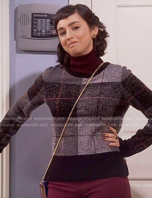 Mandy's black plaid sweater on Last Man Standing