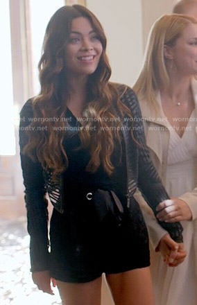 Nora’s black lace romper and striped leather jacket on The Vampire Diaries