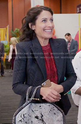 Abby’s red leopard print top, black blazer and white chain trim bag on Girlfriends Guide to Divorce