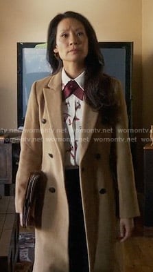 Joan’s long camel coat on Elementary