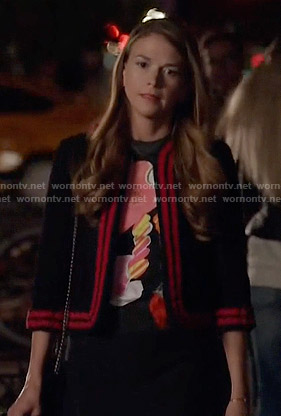 Liza’s black jacket with red striped trim on Younger