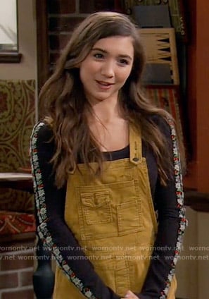 Riley’s yellow overalls and black top with floral embroidered sleeves on Girl Meets World