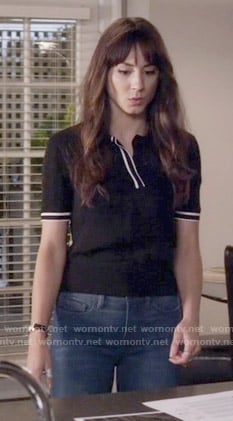 Spencer’s black polo top with white trim on Pretty Little Liars