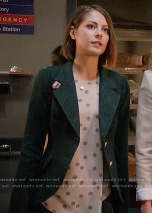 Thea’s medallion dotted top and green checked blazer with leather details on Arrow