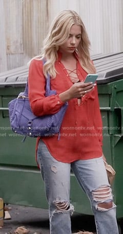 Hanna’s red lace-up blouse and ripped jeans on Pretty Little Liars