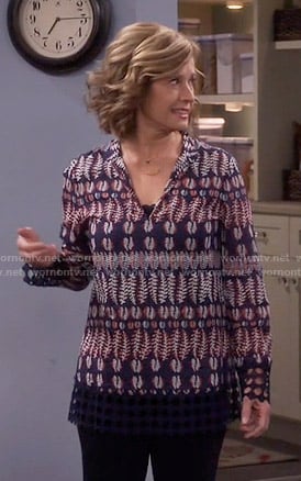 Vanessa’s navy feather print top on Last Man Standing