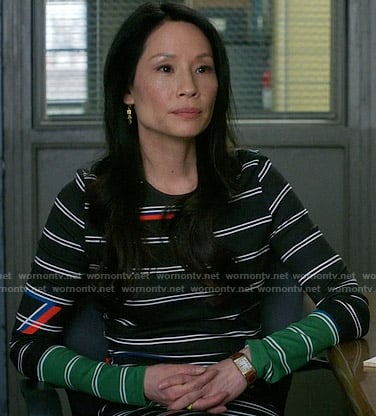 Joan's black striped long sleeve dress on Elementary