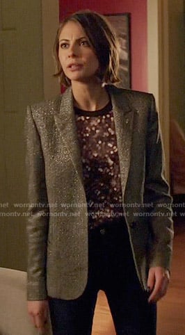 Thea's dotted print top and silver blazer on Arrow