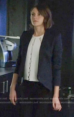 Thea's white cutout inset top and diamond textured blazer on Arrow