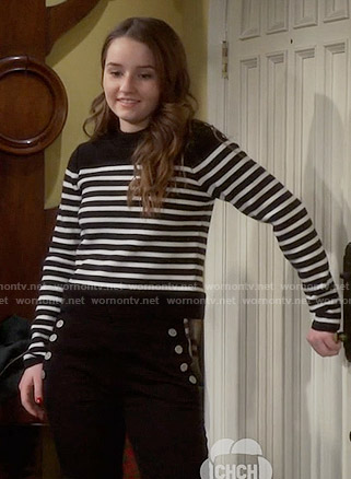 Eve’s black and white striped sweater on Last Man Standing