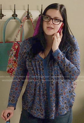 Alex's blue printed v-neck top on Modern Family