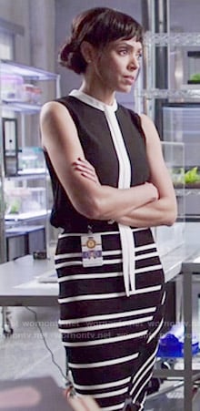 Camille's black top with white tie and striped skirt on Bones