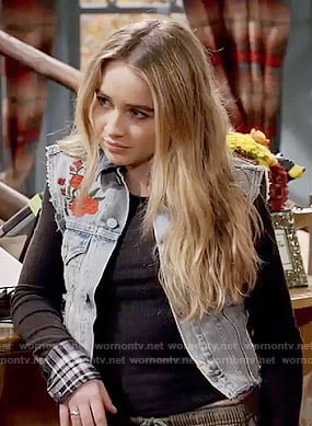 Maya's black top with plaid cuffs and embroidered denim vest on Girl Meets World