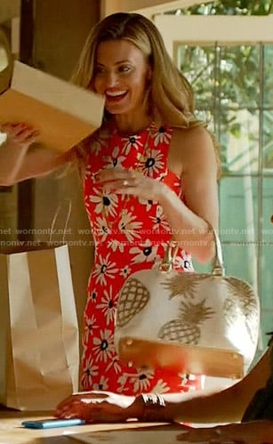 Paige’s red daisy print dress and gold pineapple bag on Royal Pains