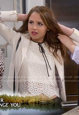 Sofia's white lace top with black tie neck on Young and Hungry