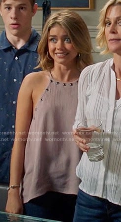 Haley's pink grommet trim top on Modern Family