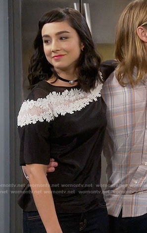 Mandy's black top with white lace stripe on Last Man Standing