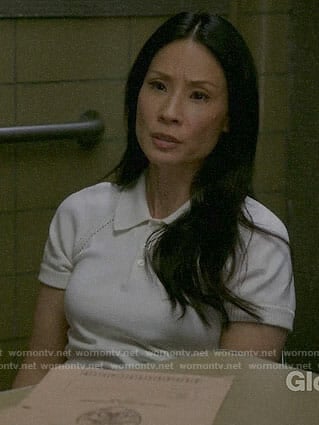 Joan's white knit polo top on Elementary