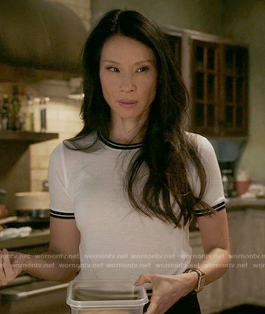 Joan's white tee with black trim on Elementary