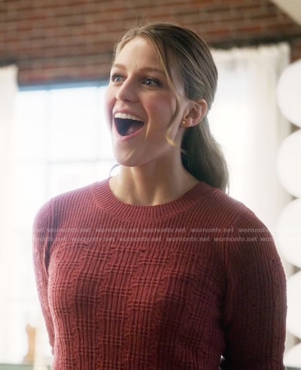 Kara’s red textured sweater on Supergirl