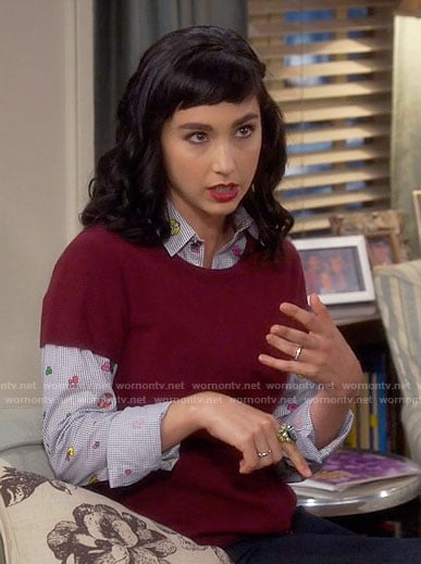 Mandy’s blue printed shirt and red sweater on Last Man Standing