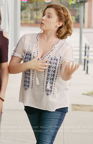Rebecca's white top with blue embroidery and green quilted sneakers on Crazy Ex-Girlfriend
