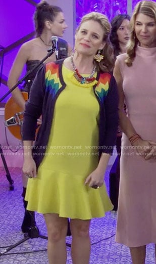 Kimmy's yellow dress, rainbow striped cardigan and taco clutch on Fuller House