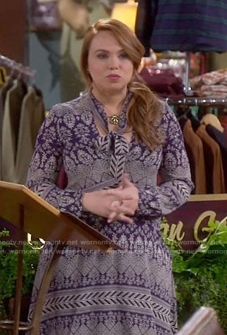 Kristin’s blue printed tie-neck dress on Last Man Standing