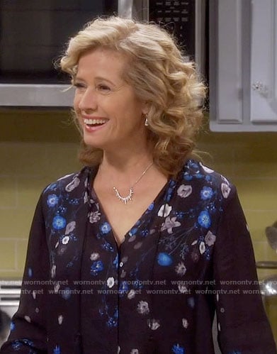 Vanessa’s black and blue floral blouse on Last Man Standing