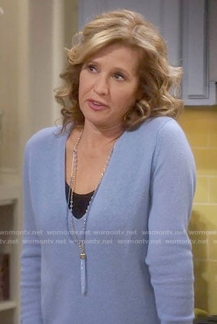 Vanessa’s blue v-neck sweater on Last Man Standing