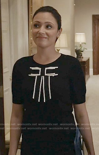 Emily's black top with white trimmed bow on Designated Survivor