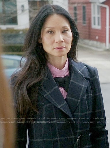 Joan's pink top with black bow on Elementary