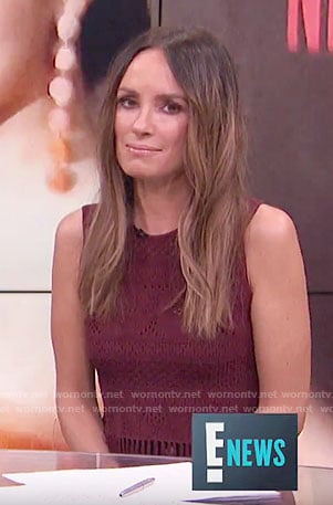 Catt’s burgundy sleeveless fringed top on E! News