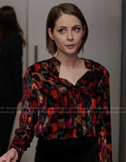 Thea’s black and red printed blouse on Arrow