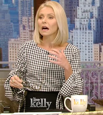 Kelly's checked top with adjustable sleeves and black skirt on Live With Kelly