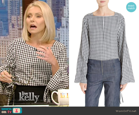 WornOnTV: Kelly’s checked top with adjustable sleeves and black skirt ...