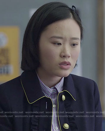 Courtney’s navy jacket with ruffles and yellow trim on 13 Reasons Why