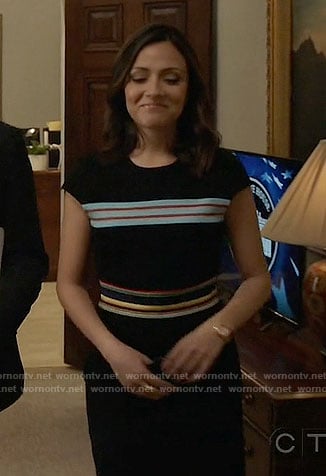 Emily’s black dress with multi-colored stripes on Designated Survivor