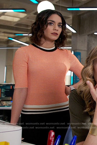 Emily's orange sweater with striped trim on Powerless