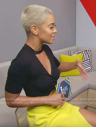Sibley's black cutout crop top and yellow asymmetrical skirt on E! News