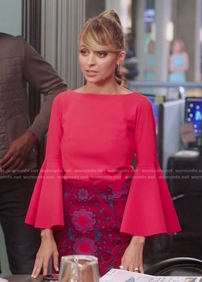 Portia’s red bell sleeve top and lace skirt on Great News