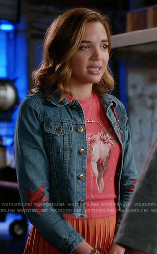 Cassie's red skull print top and star print denim jacket on Famous in Love