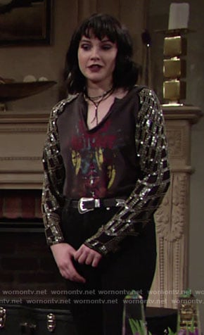 Tessa’s black graphic tee with sequin sleeves on The Young and the Restless